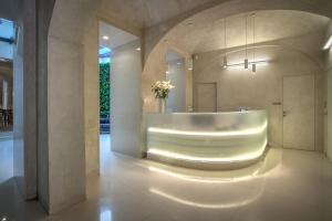 a bathroom with a sink and a mirror at Bishop's House in Prague