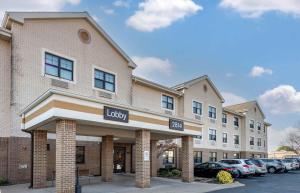 a large building with a sign for a library at Extended Stay America Suites - Rochester - North in Rochester