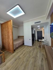 a bedroom with a bed and a table in a room at Alvina in Tsaghkadzor