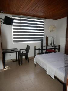 Ένα ή περισσότερα κρεβάτια σε δωμάτιο στο Apartamento Melgar Central Piscina Conjunto