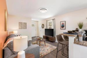 a living room with a couch and a table at Renovated 2BR *Central Location* in Johnson City