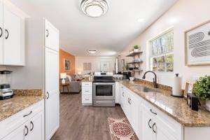 a kitchen with white cabinets and a counter top at Renovated 2BR *Central Location* in Johnson City