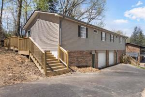 a house with a staircase leading to a garage at Renovated 2BR *Central Location* in Johnson City