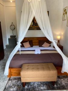 Ένα ή περισσότερα κρεβάτια σε δωμάτιο στο Munduk Twin Homestay