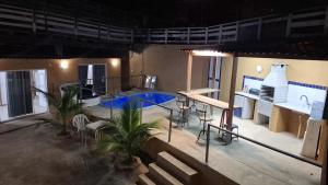 an aerial view of a room with a tennis court at Casa Albatroz - primeira locaçao 4 suites in Búzios