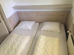 En eller flere senge i et værelse på 1-bedroom bungalow
