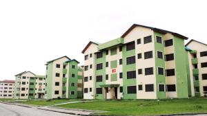 a row of green and white apartment buildings at The Nobles Luxurious 2 Bedroom Apartment in Kumasi