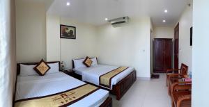 Postel nebo postele na pokoji v ubytování Thăng Long Hotel Thanh Hoá