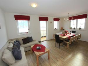 a living room with a couch and a table at Apartment in Aschau near Ski Slopes in Aschau +36 photos