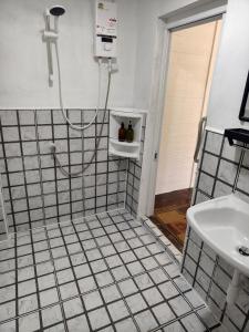 a bathroom with a shower and a sink at Moon River Resort Phimai in Pi Mai +53 photos