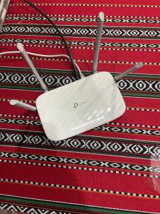 a white object sitting on top of a rug at Jabal Shams, the summit house in Misfāh
