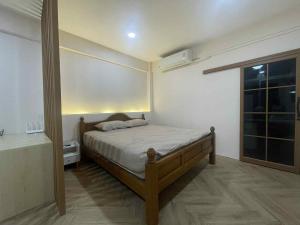 Giường trong phòng chung tại Dime Rama III