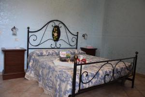 a bedroom with a bed with a butterfly headboard at Postiglione Country House in Cingoli