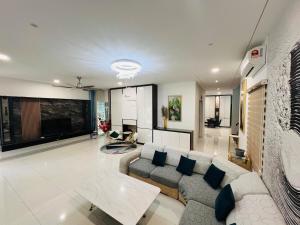 a living room with a couch and a table at 3KM to UTAR Sungai Long Party House 45Pax 20Car in Kajang