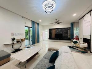 a living room with a couch and a table at 3KM to UTAR Sungai Long Party House 45Pax 20Car in Kajang