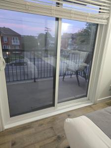 a room with a window with a view of a balcony at Bright Spacious 2 BDR Condo 10 min to DT Ottawa in Gatineau