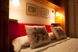 Postel nebo postele na pokoji v ubytování Le Rosier B&B e Appartamento