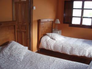 Łóżko lub łóżka w pokoju w obiekcie Casa Rural Ugarte Ojacastro