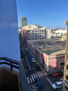 a view of a city with cars parked on a street at Apartamento Las Canteras in Las Palmas de Gran Canaria