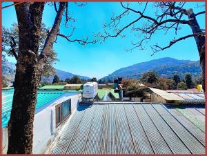a view from the roof of a house at HOTEL You & Me Near Mall Road & NAINI LAKE - Free Wifi & Room Service With Parking Facilities - Hygiene and Spacious Room - The Best Hotel with Mountain Views - Best Hotel In Nainital in Nainital +17 photos