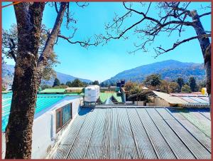 a view from the roof of a house at HOTEL You & Me Near Mall Road & NAINI LAKE - Free Wifi & Room Service With Parking Facilities - Hygiene and Spacious Room - The Best Hotel with Mountain Views - Best Hotel In Nainital in Nainital