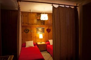 Postel nebo postele na pokoji v ubytování Le Rosier B&B e Appartamento