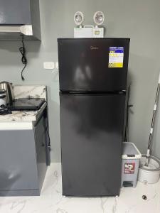 Η κουζίνα ή μικρή κουζίνα στο Mr Home Stays Valencia City Bukidnon