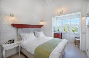 Postel nebo postele na pokoji v ubytování Alakapi Hotel & Villas