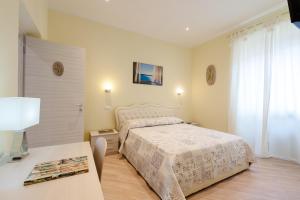 Postel nebo postele na pokoji v ubytování Guest House Le Tre Spezie