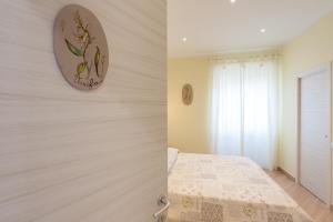 Postel nebo postele na pokoji v ubytování Guest House Le Tre Spezie