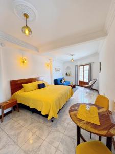 Postel nebo postele na pokoji v ubytování El Viejo Café - House with terrace and colonial charm