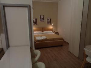 Postel nebo postele na pokoji v ubytování San Andreas Suites