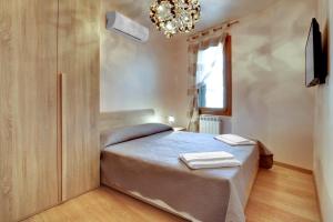 Postel nebo postele na pokoji v ubytování Locanda Delle Acque