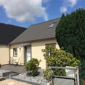 a yellow house with a black roof at Haus Kummer in Selm