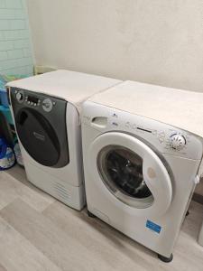 a washing machine and a dryer sitting next to each other at Da Lina in Aosta +4 photos