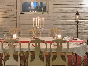 a dining room with a table with candles on it at 9 person holiday home in Tystberga in Tystberga