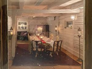 a dining room with a table and chairs in a room at 9 person holiday home in Tystberga in Tystberga