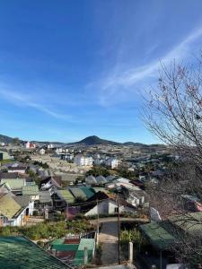 a city with houses and a mountain in the background at Nhà MIO in Khu Chi Lăng +20 photos