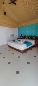 Postel nebo postele na pokoji v ubytování Royal Galaxy Spring Resort