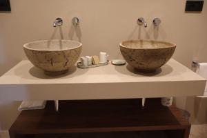 two bowls sitting on a counter in a bathroom at Agriturismo Radici by Miky in Monterosso al Mare