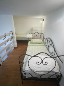 a room with two beds in a room at Small apartment in center in Montesilvano