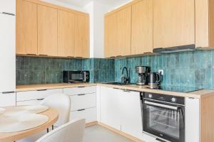 Køkken eller tekøkken på Baltic Dream - SPA - Basen - Parking - Kids Room