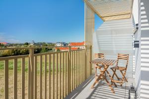 En balkon eller terrasse på Baltic Dream - SPA - Basen - Parking - Kids Room