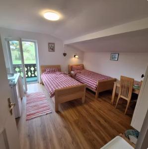 En eller flere senge i et værelse på Sonniges Appartement und Gästezimmer, Haus Borowiec