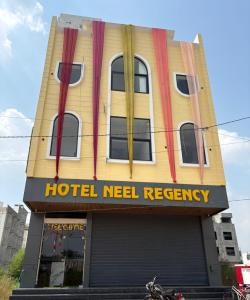 a hotel neelhewreasy sign on the front of a building at Hotel Neel Regency in Kurukshetra