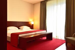 Cama ou camas em um quarto em Pousada De Viseu
