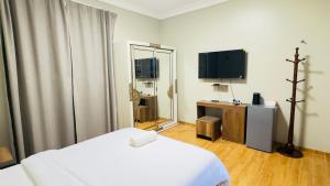 TV/trung tâm giải trí tại the villas Hotel