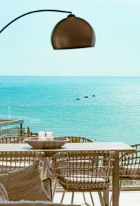 a table and chairs with a view of the ocean at Mara's Apartments Higuerón - Azzurro Med Two Collection - Seaviews in Fuengirola