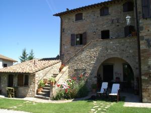 an external view of a stone house with a garden at Holiday Home in Montone with Pool & Terrace in Montone +15 photos