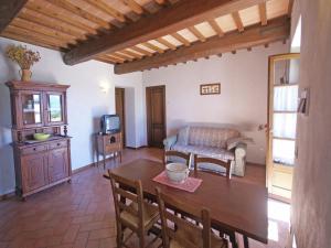 a living room with a table and a couch at Holiday Home in Montone with Pool & Terrace in Montone